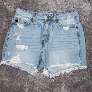 Women’s Kancan rainbow thread jean shorts.